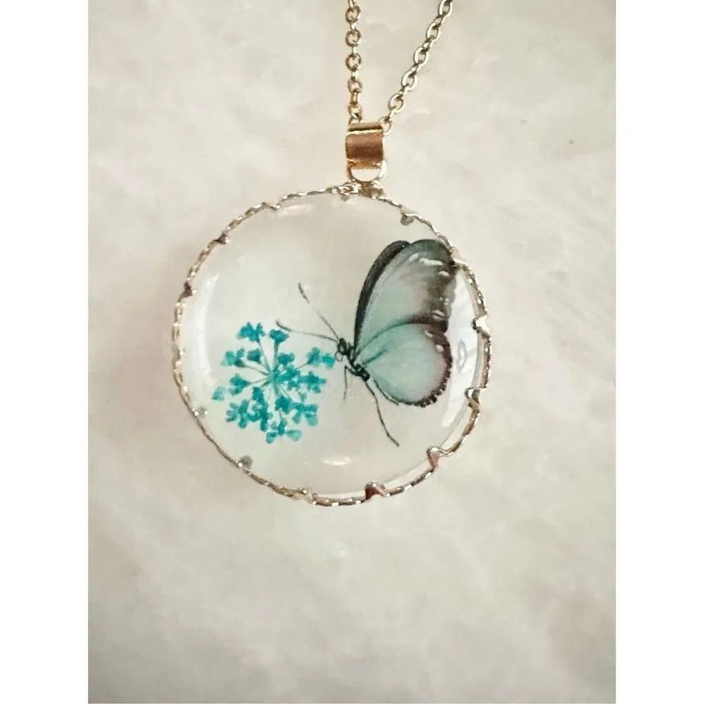 Baby blue butterfly with blue flowers pendant necklace ￼